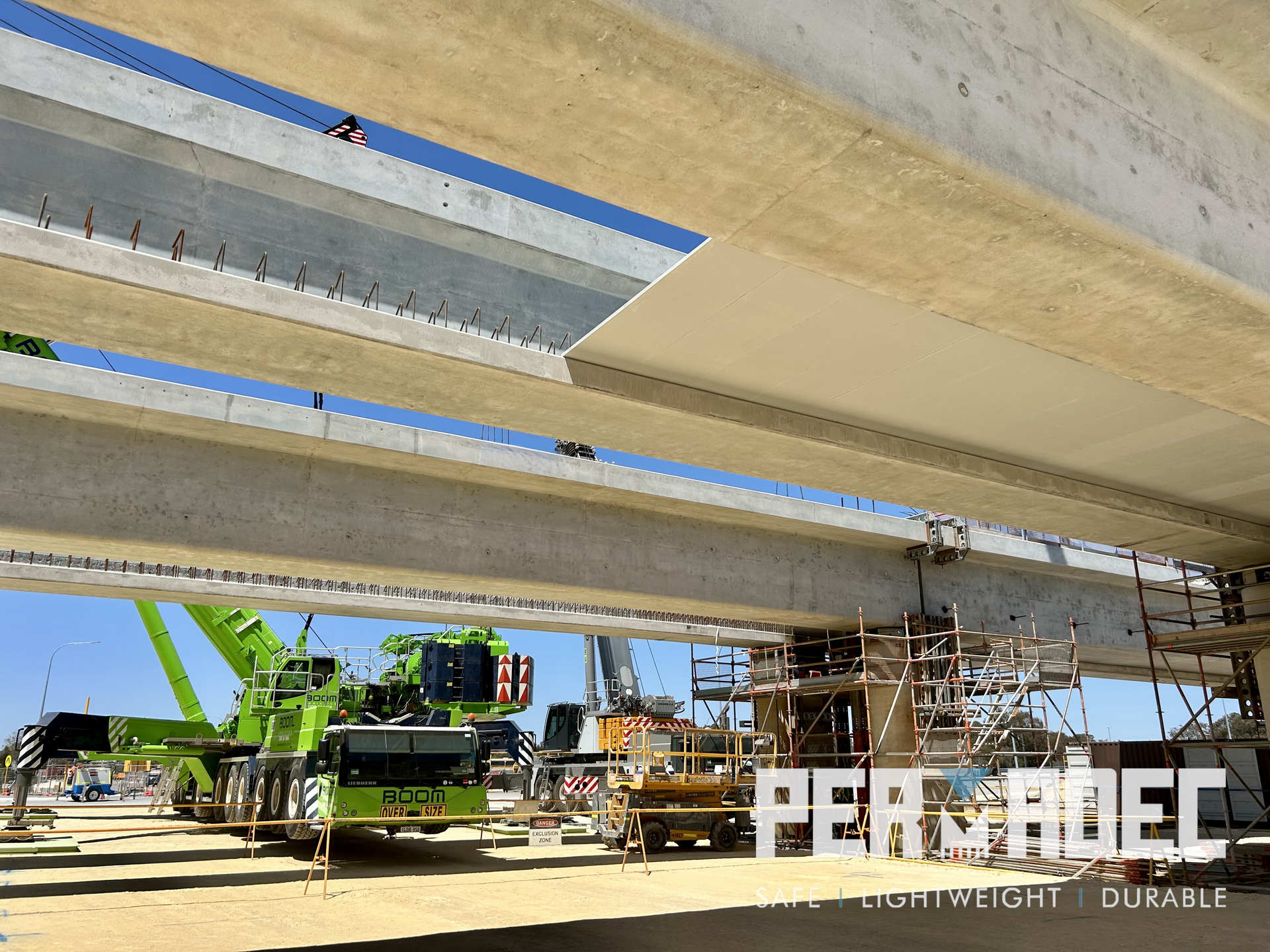 Close-up view of Permadec Glass Reinforced Polymer (GRP) permanent formwork panels installed on precast beams at Whiteman Park, highlighting a smooth soffit finish.