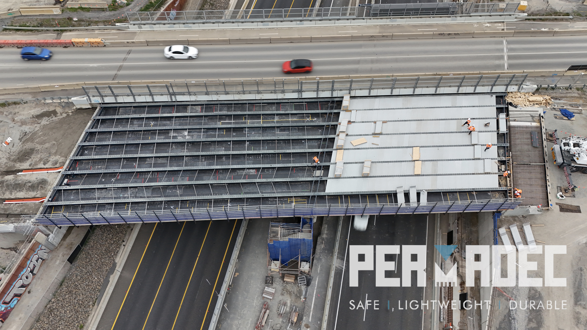 Aerial view of GRP formwork installation by Permadec over live highway at Majors Road Interchange. Glass reinforced polymer panels used for permanent bridge formwork.